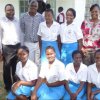 ncic officers with a section of amani club officials of st. alloys girls in kisumu county